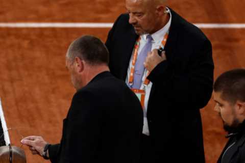 French Open semi-final suspended as female protester ties herself to net in middle of Cilic vs Ruud match