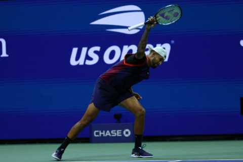 Nick Kyrgios clashes with fans, smashes racket, throws bottle on court and spits towards his team after US Open defeat