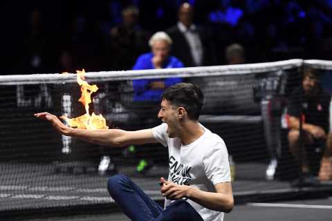 Bizarre moment idiot sets himself on FIRE before getting carried out by security at Laver Cup at O2 Arena