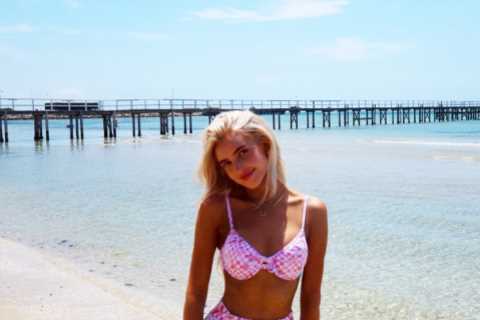 Morgan Riddle stuns in pink bra and trousers on the beach before Taylor Fritz’s Australian Open defeat