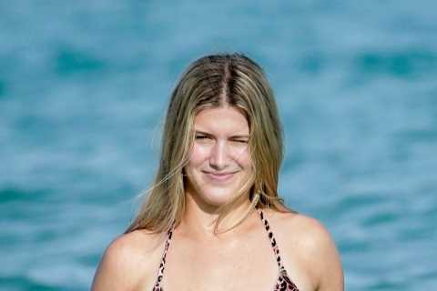 Tennis star Eugenie Bouchard strips down to leopard bikini as she puts Australian Open exit behind her on beach in Miami