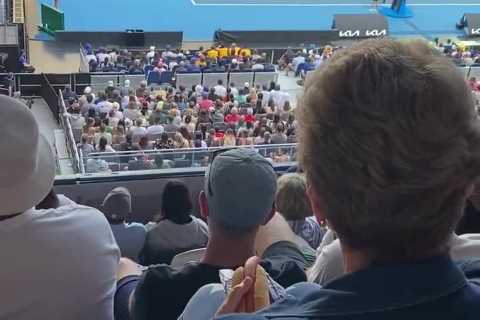 ‘Good lord!’ – Tennis fans split after video of woman eating hot dog in stands at Australian Open goes viral