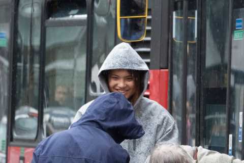 Emma Raducanu helps elderly couple getting off bus in pouring rain as she recovers from surgery